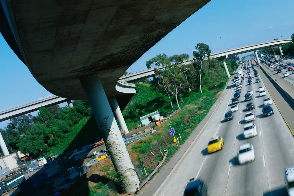 View from under tall freeway overpass in Los Angeles at intersection of I-405 and I-10.